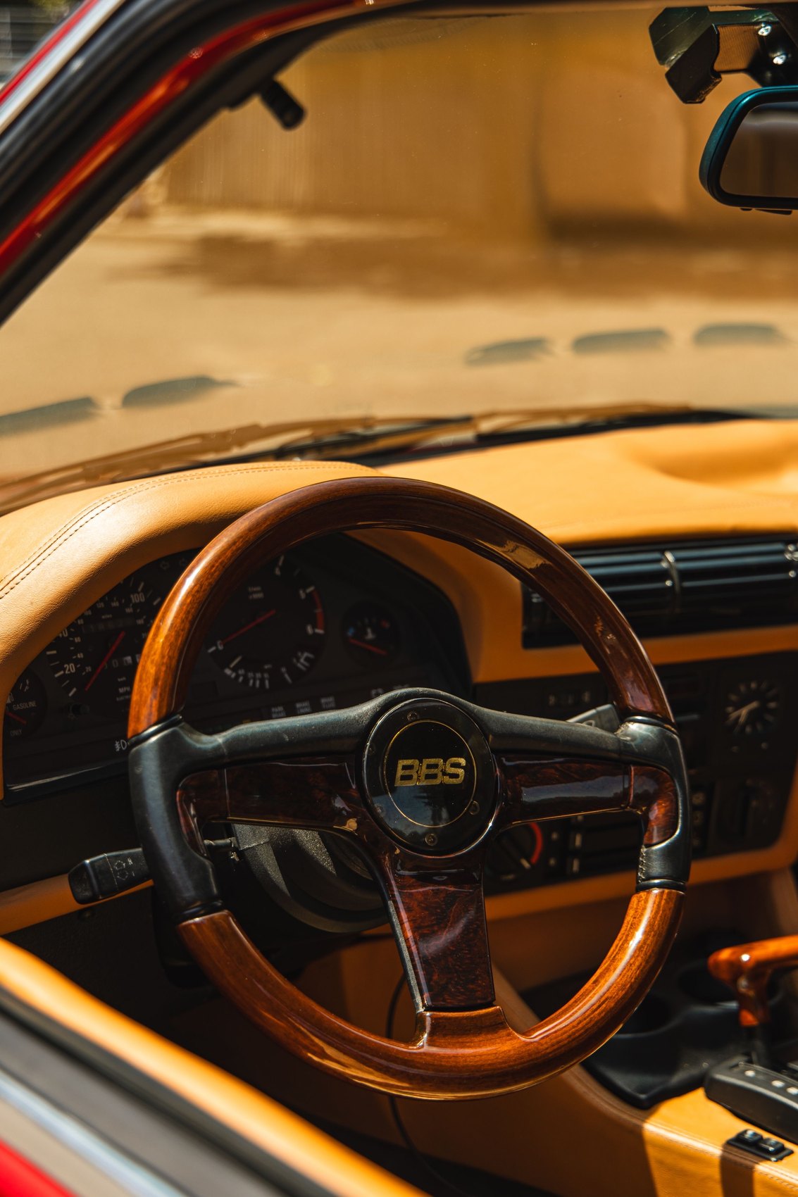 Wood steering wheel and tan interior detail